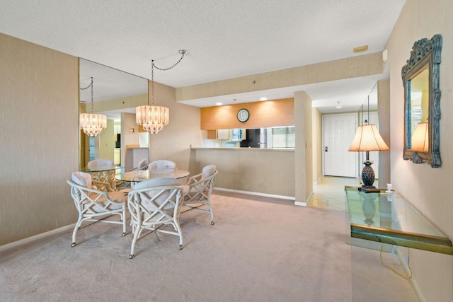 carpeted dining room with a notable chandelier and a textured ceiling