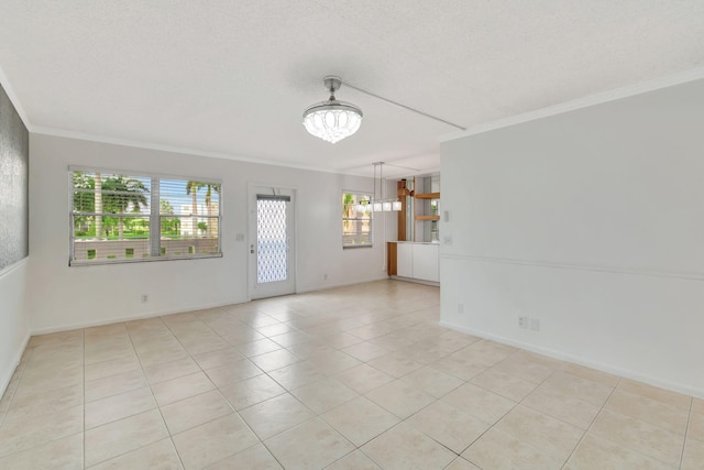 unfurnished room featuring plenty of natural light, light tile patterned flooring, and a chandelier