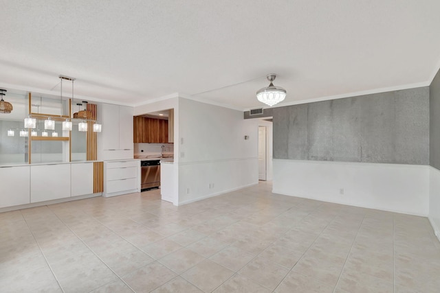 unfurnished living room with sink, light tile patterned floors, and a textured ceiling