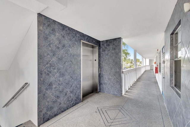 2006 Exeter A, Boca Raton, FL 33434 - view of patio featuring elevator and a balcony
