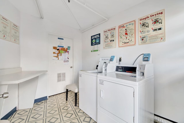 2006 Exeter A, Boca Raton, FL 33434 - community laundry with washing machine and clothes dryer and light tile patterned floors
