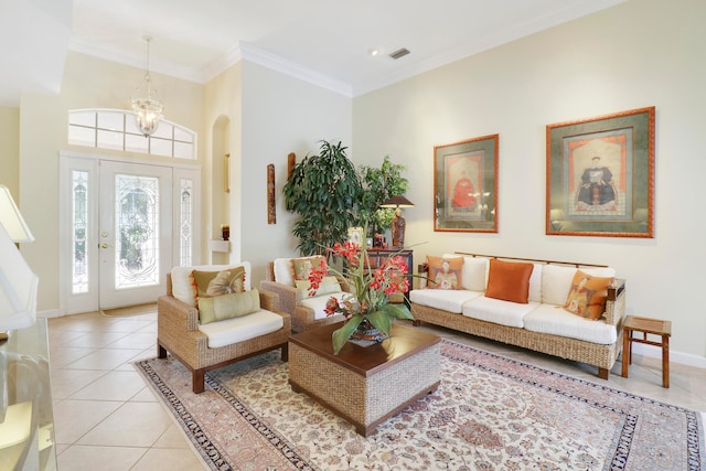 tiled living room with a notable chandelier and crown molding