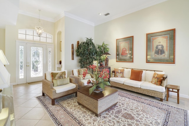 8100 Alister Pl, Port Saint Lucie, FL 34986 - living room featuring light tile patterned floors, baseboards, ornamental molding, and arched walkways