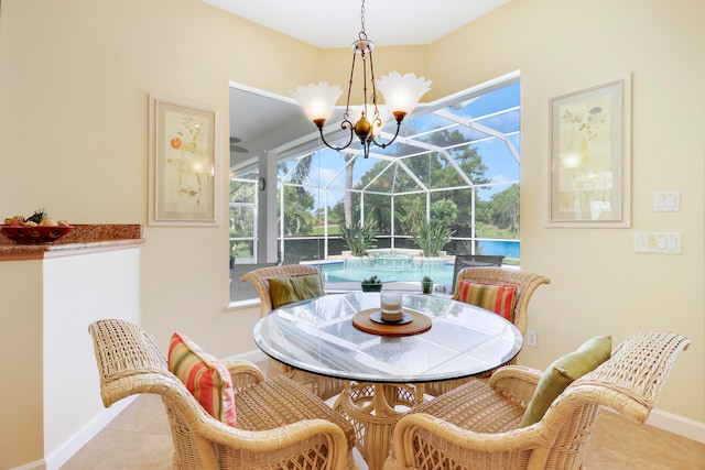 dining area with an inviting chandelier and tile patterned floors