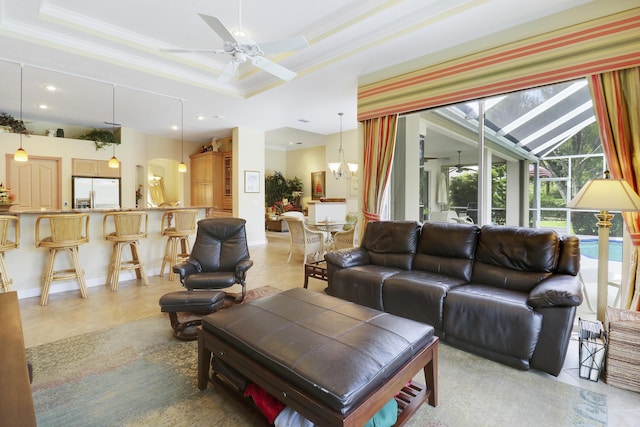 8100 Alister Pl, Port Saint Lucie, FL 34986 - living room with ceiling fan, ornamental molding, a tray ceiling, light tile patterned floors, and recessed lighting