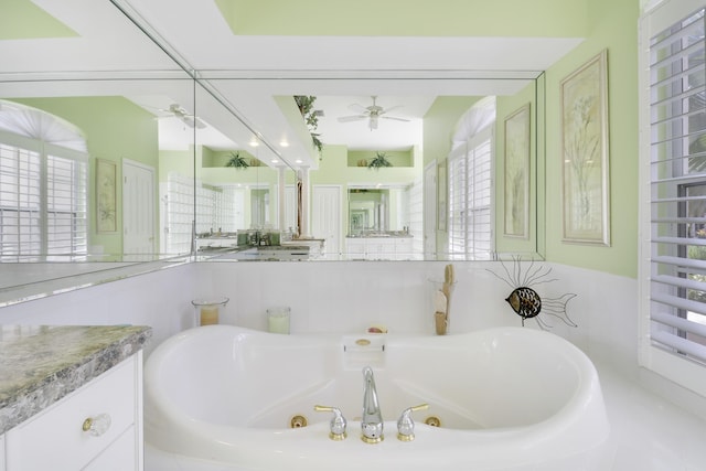 8100 Alister Pl, Port Saint Lucie, FL 34986 - bathroom with a ceiling fan, a jetted tub, and plenty of natural light