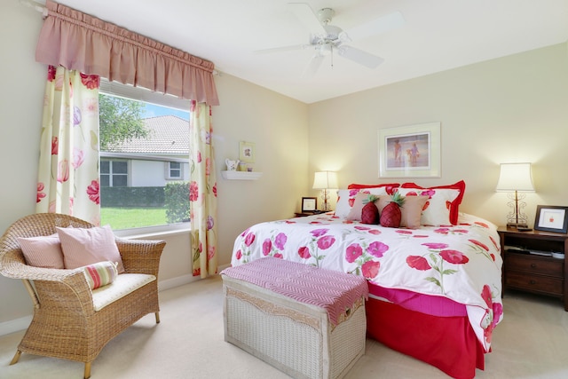 bedroom featuring ceiling fan and light colored carpet