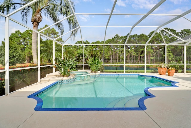 view of pool featuring glass enclosure, an in ground hot tub, and a patio area
