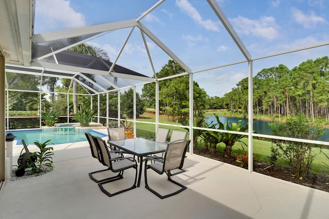 view of patio featuring a water view and glass enclosure