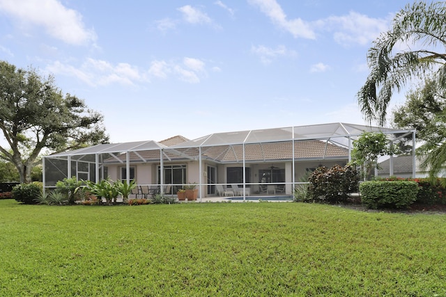 8100 Alister Pl, Port Saint Lucie, FL 34986 - back of house featuring a yard, stucco siding, and a lanai