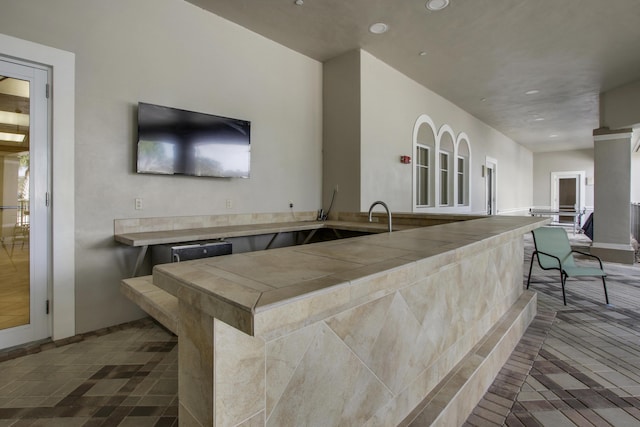 8100 Alister Pl, Port Saint Lucie, FL 34986 - bar with recessed lighting and baseboards