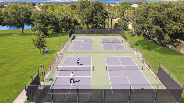 view of tennis court with a lawn and basketball court