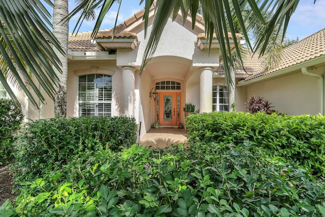 property entrance featuring french doors