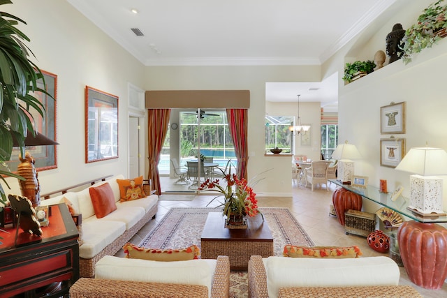 living room with light tile patterned floors, an inviting chandelier, and ornamental molding