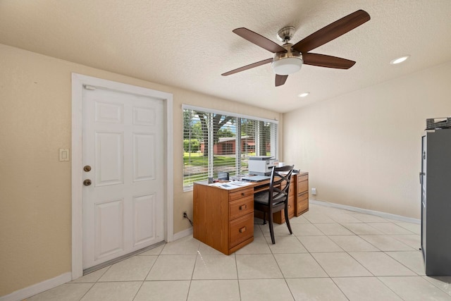 office featuring ceiling fan, a textured ceiling, and light tile patterned floors