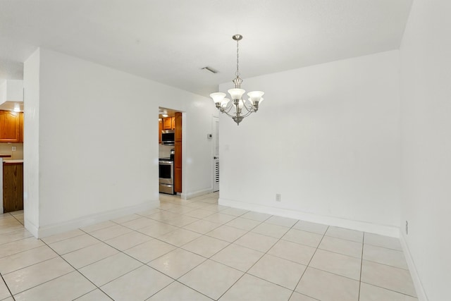 spare room featuring a chandelier, visible vents, baseboards, and light tile patterned floors