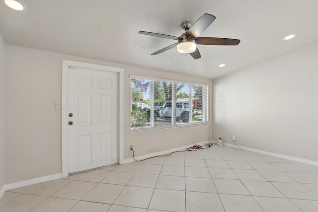 empty room featuring recessed lighting, a ceiling fan, and baseboards