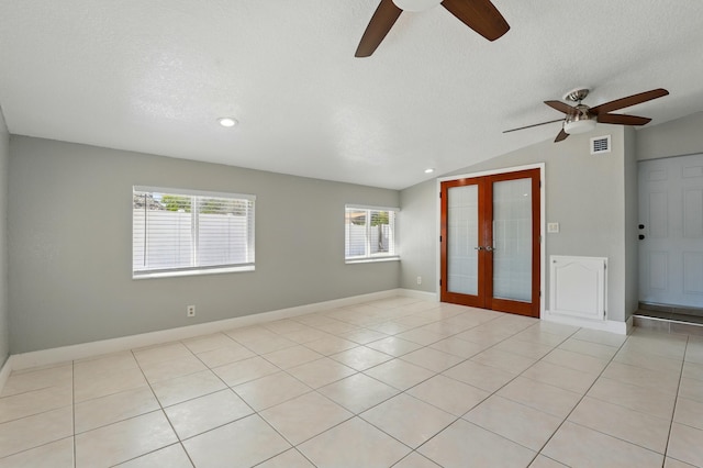 unfurnished bedroom with recessed lighting, vaulted ceiling, visible vents, french doors, and a textured ceiling