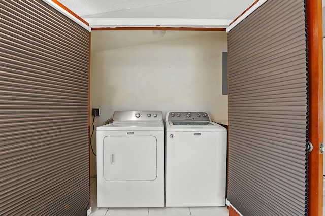 washroom with laundry area, light tile patterned floors, and washing machine and dryer