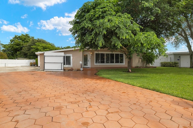 exterior space with a front lawn and a garage