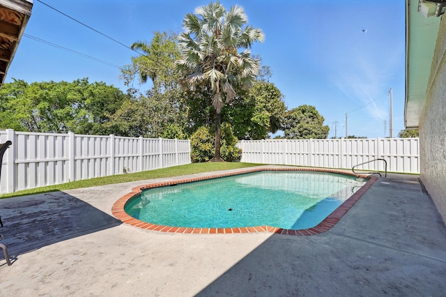 view of swimming pool featuring a fenced backyard, a patio area, and a fenced in pool