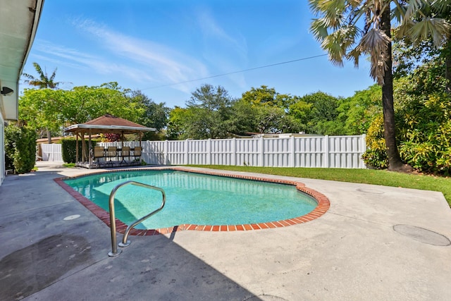 view of pool with a fenced backyard, a fenced in pool, and a patio