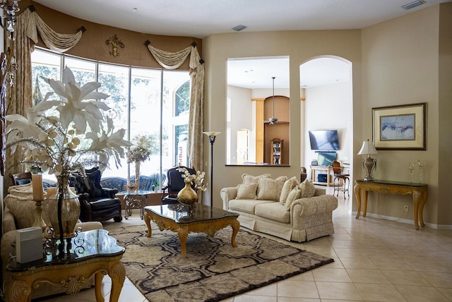 tiled living room featuring a healthy amount of sunlight