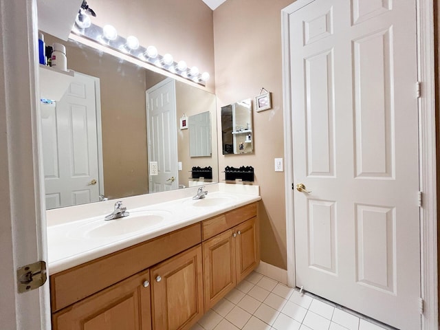 bathroom with tile patterned flooring and vanity