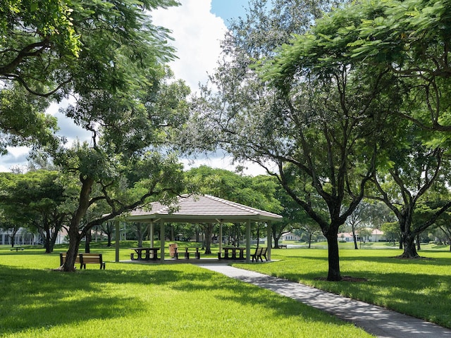 surrounding community with a gazebo and a lawn