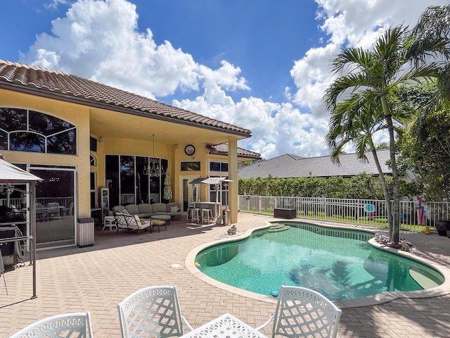 view of swimming pool featuring outdoor lounge area and a patio