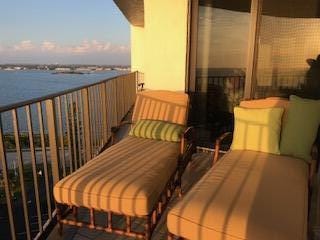 balcony featuring a water view