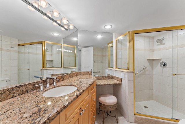 bathroom with tile walls, tile patterned flooring, and a shower stall