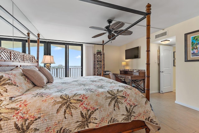 bedroom with visible vents, light wood-style flooring, a ceiling fan, access to outside, and baseboards