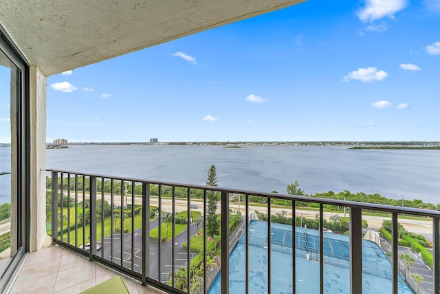 balcony featuring a water view