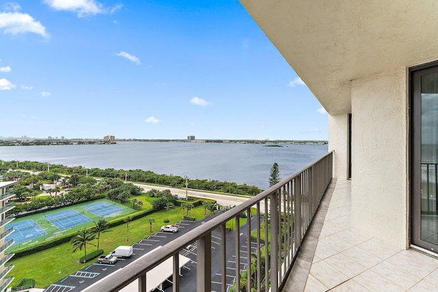 balcony featuring a water view