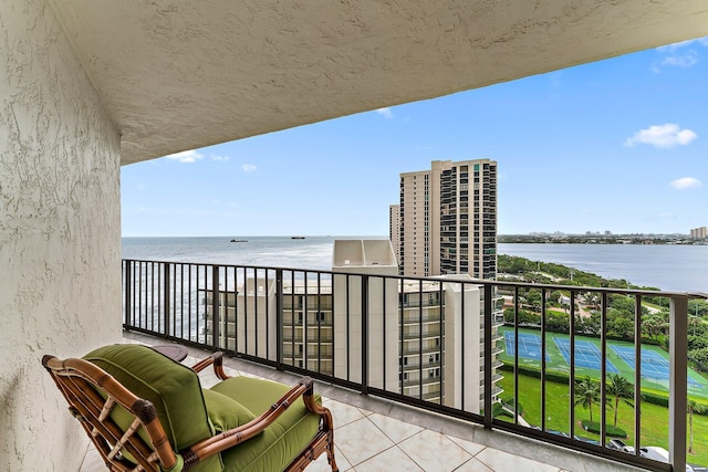 balcony featuring a water view