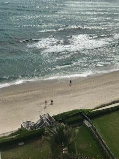 drone / aerial view with a view of the beach and a water view