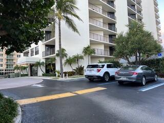 view of building exterior featuring uncovered parking