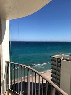 balcony featuring a water view