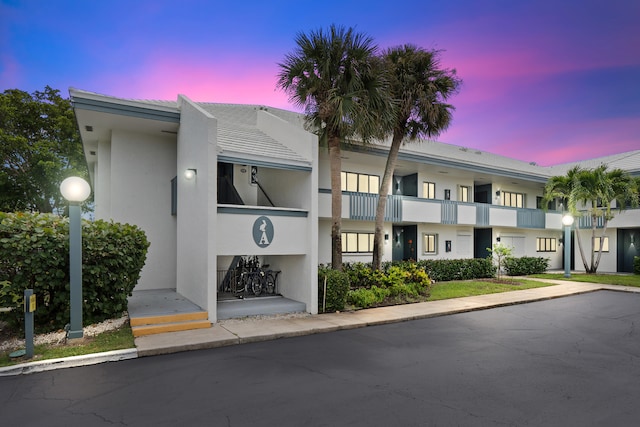 view of outdoor building at dusk