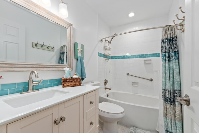 full bathroom featuring vanity, toilet, and shower / bath combination with curtain