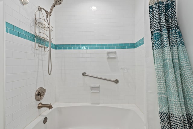 bathroom with shower / bathtub combination with curtain