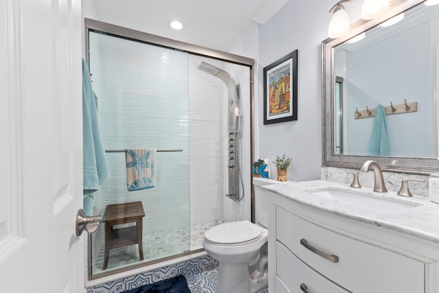 bathroom with ornamental molding, vanity, toilet, and a shower with door