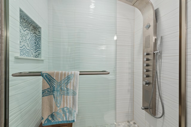 bathroom with a shower with shower door