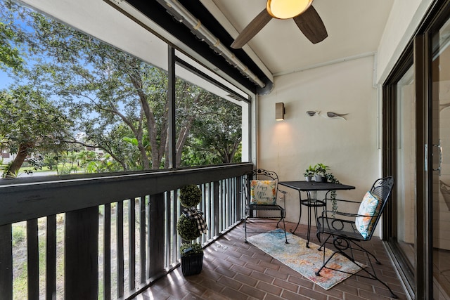 sunroom / solarium with ceiling fan