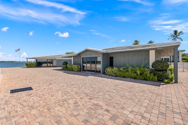 ranch-style house with a water view