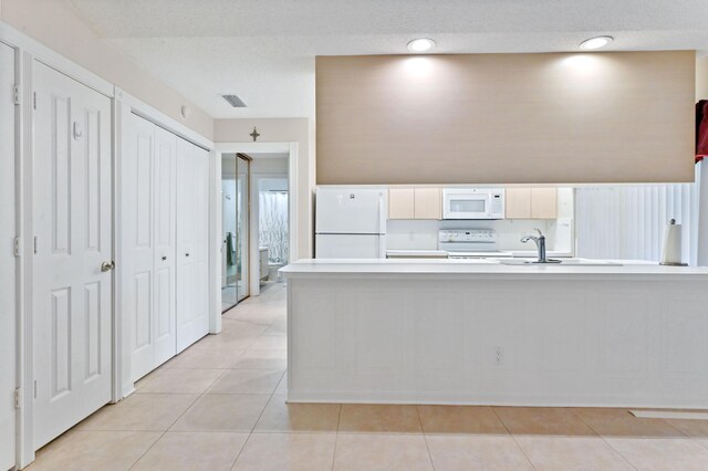 kitchen featuring white cabinetry, dishwasher, decorative light fixtures, electric stove, and light tile patterned floors