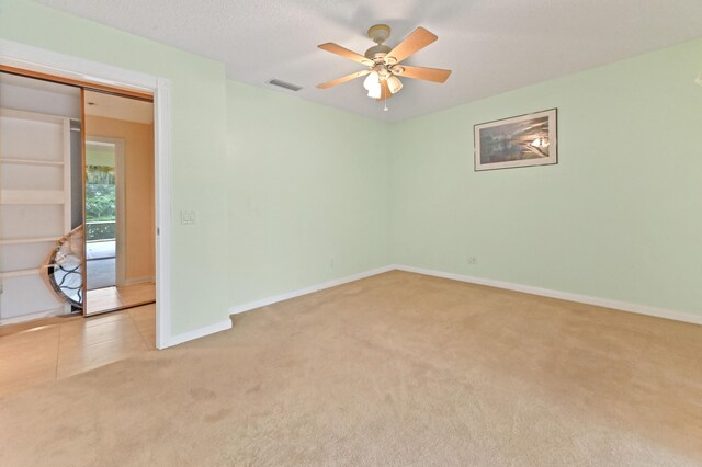 unfurnished room featuring ceiling fan