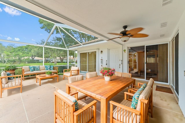 view of patio / terrace featuring a lanai, an outdoor hangout area, and ceiling fan