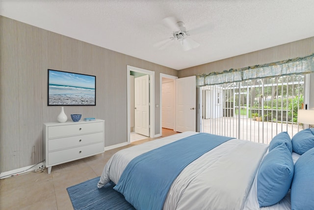 bedroom with ceiling fan, a textured ceiling, and access to outside